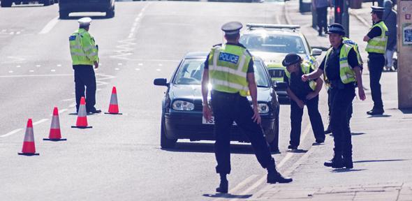Police stopping traffic in UK lockdown