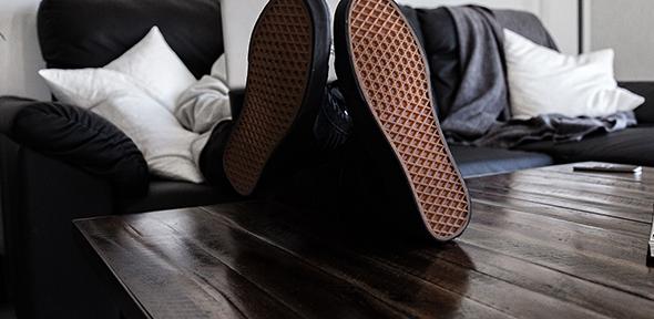 Person sitting on sofa with laptop