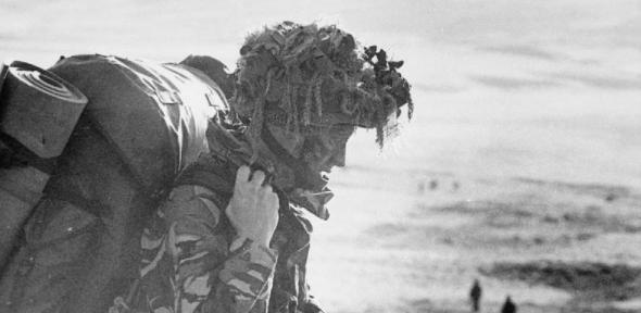 After landing at San Carlos, a heavily laden paratrooper of 2 Parachute Regiment heads south for Sussex Mountain on 21 May 1982. From there the Battalion attacked Goose Green. 
