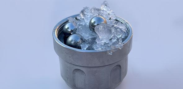 Part of the set-up for creating medium-density amorphous ice: ordinary ice and steel balls in a jar (not amorphous ice)