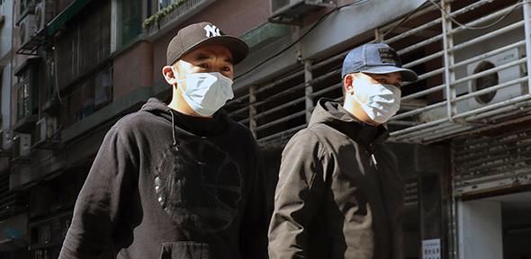 Men in masks, Macau, PRC
