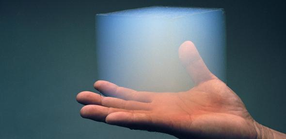 A block of silica aerogel being held in a person's hand