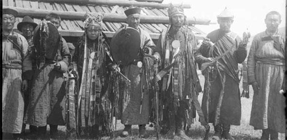 A shaman, shamaness and Achinsk Lama with helpers, June 1912. Right: A young boy with his sister, July/August 1912.