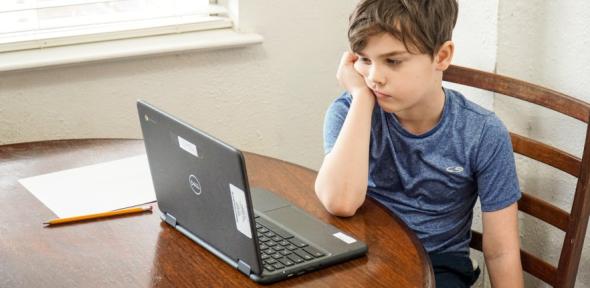 Boy taking part in a virtual lesson