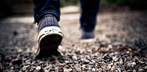 Feet walking on gravel