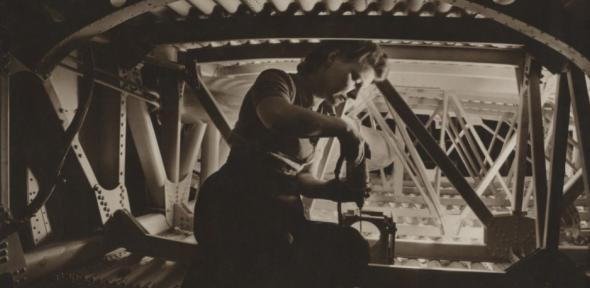 Woman working on wing section, Boeing Aircraft Company.