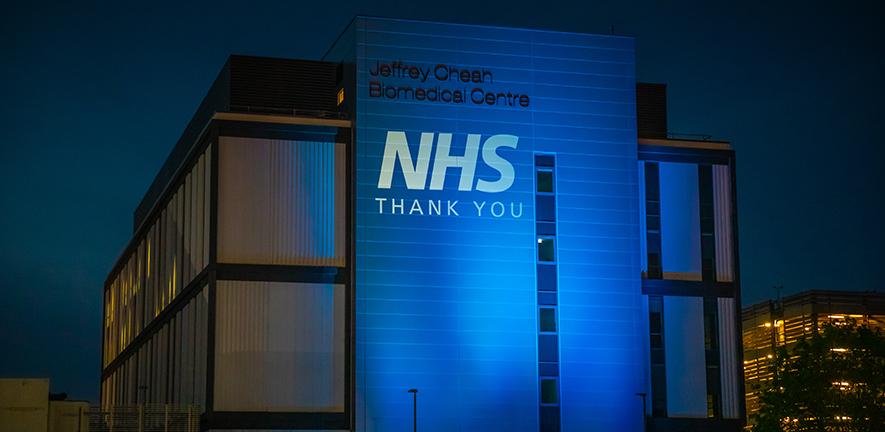 Jeffrey Cheah Biomedical Centre lit up in blue to thank the NHS