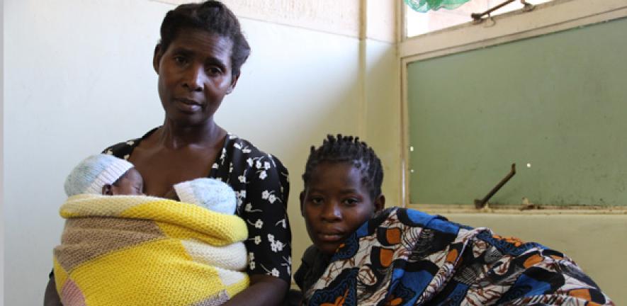 Suffering from pre-eclampsia, this young mother had to undergo a Caesarean to deliver her twin boys, seen here in the arms of her mother (Malawi)