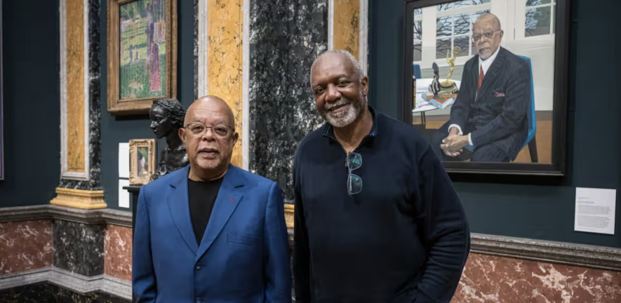 Artist Kerry James Marshall and Henry Louis 'Skip' Gates Jr stand in front of the donated portrait