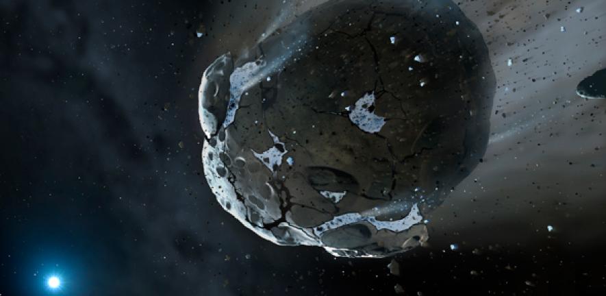 Artist impression of a rocky and water-rich asteroid being torn apart by the gravity of the white dwarf star GD 61.