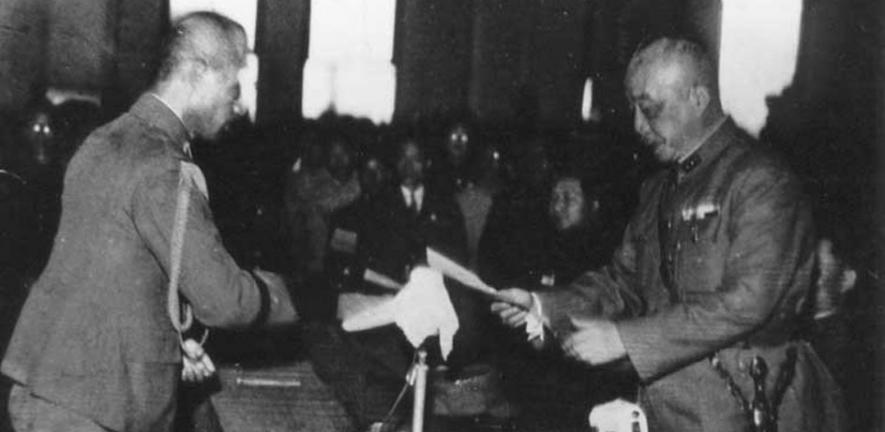 General Chen Yi of China accepts the surrender of Andō Rikichi, the Japanese Governor-General of Taiwan. The collapse of Japanese Imperial rule in the area marked the beginning of a new era for both countries.