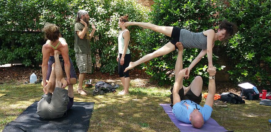 People doing yoga together outdoors in Richmond USA in 2015