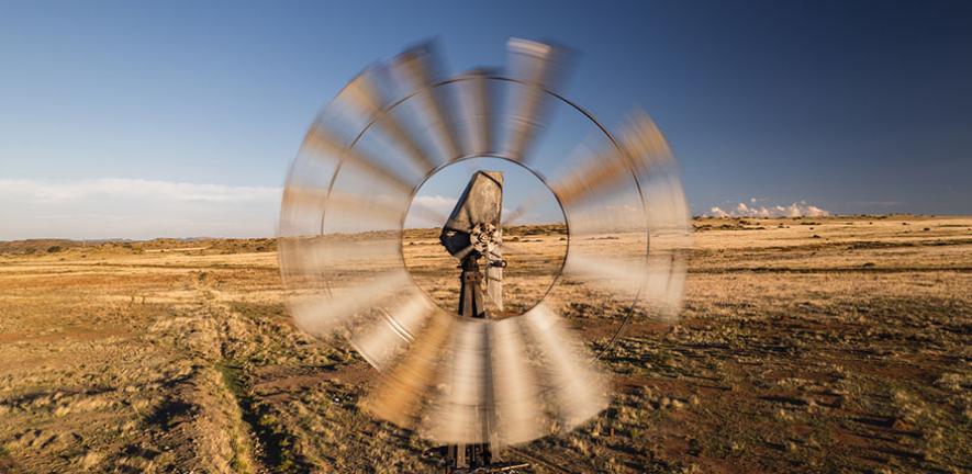 Drone shot in front of a spinning weather station, Free State, South Africa 