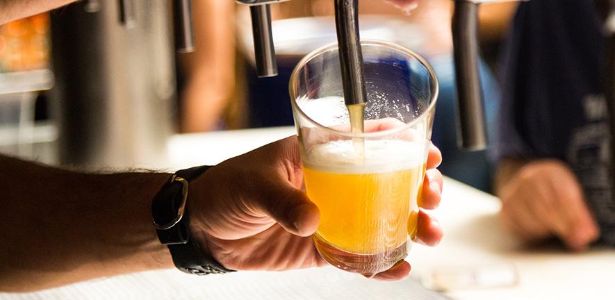 Man pouring a pint of beer