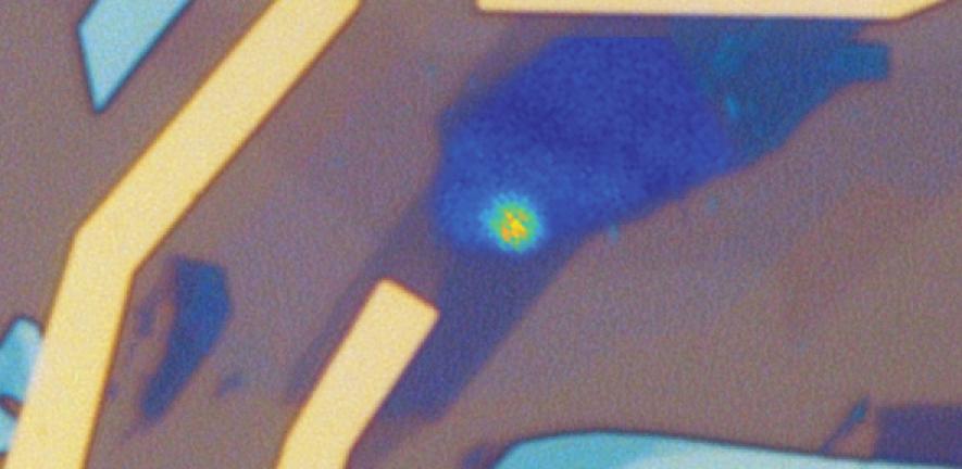 Microscope image of a quantum LED device showing bright quantum emitter generating a stream of single photons. 