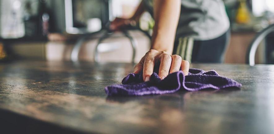 Wiping down the countertop 