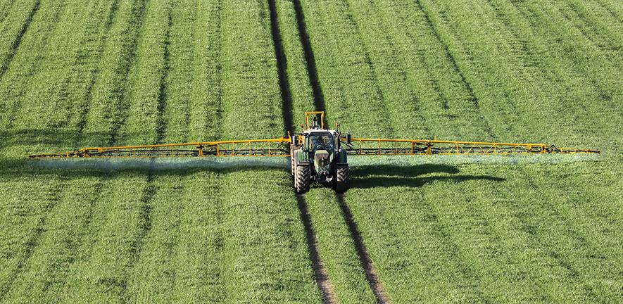 Wheat crops being sprayed with fertiliser