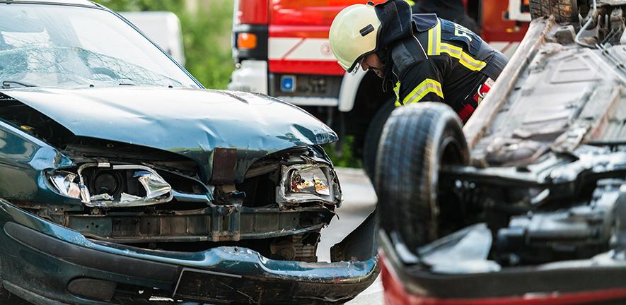 Firefighters at the scene of a car accident