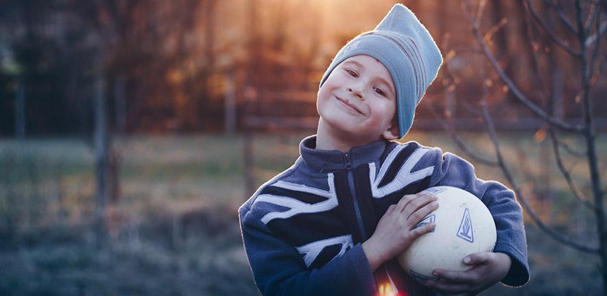 Smiling boy with a football