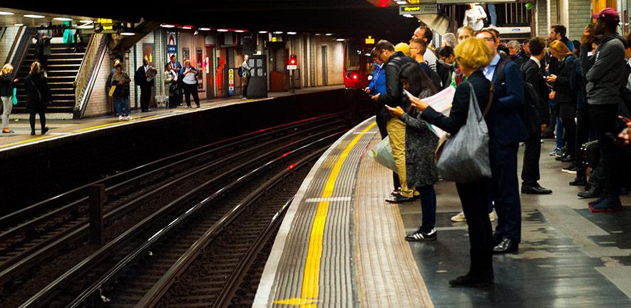 Passengers at a London Underground station