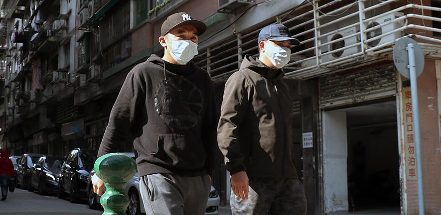 Men in masks, Macau, PRC