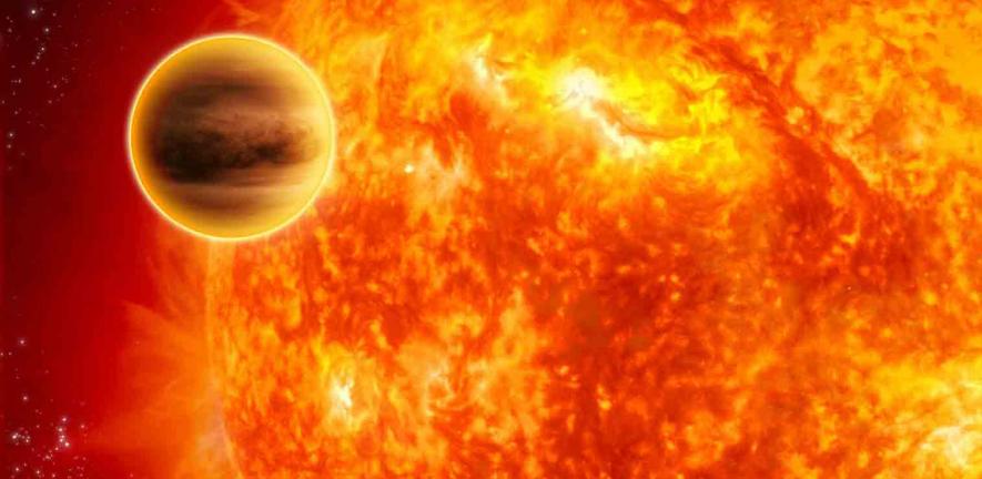 This artist's impression shows a gas-giant exoplanet transiting across the face of its star. Infrared analysis by NASA's Spitzer Space Telescope.