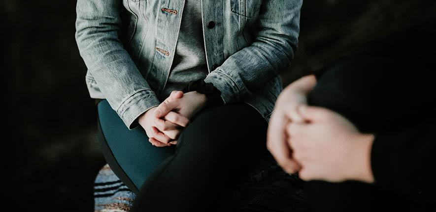 Close up of hands of two people talking