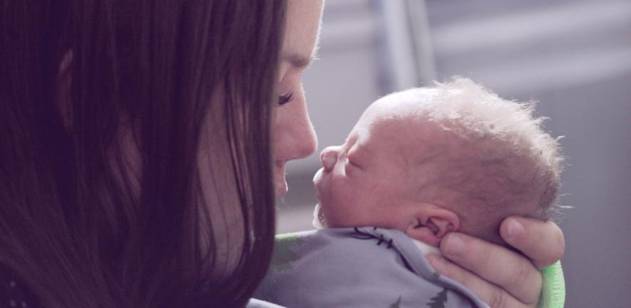 Woman and newborn baby