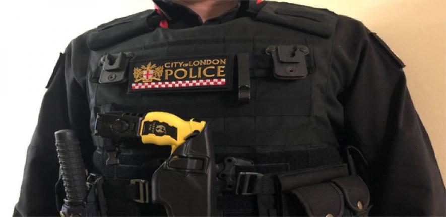 A City of London police officer armed with a Taser