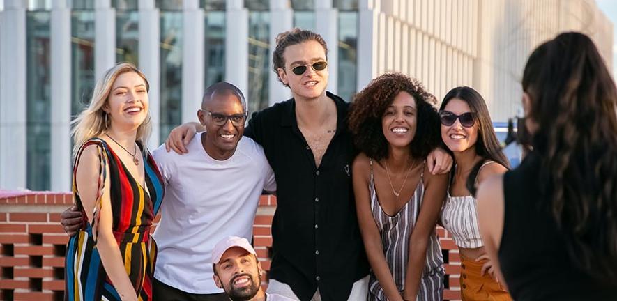 Millennials pose for a photo