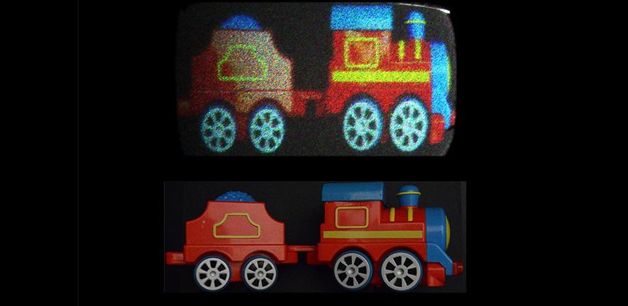 Reconstructed holographic images of a toy train with holobricks and original image captured by a camera