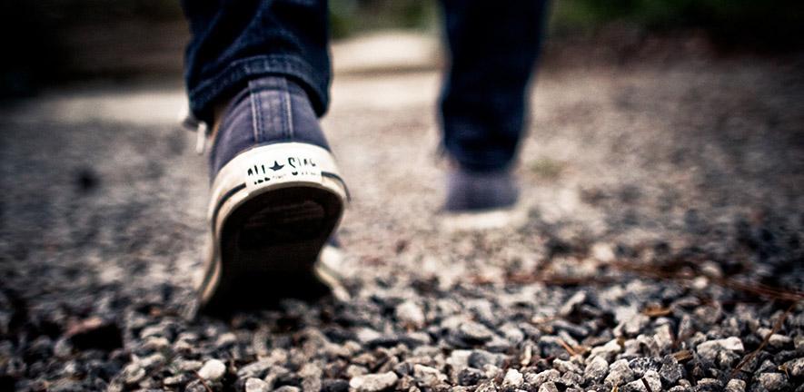 Feet walking on gravel