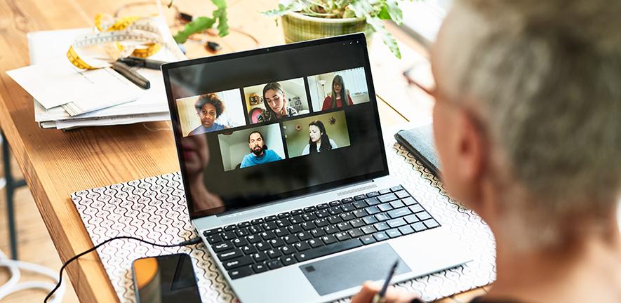 Woman using laptop for team meeting 