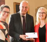Dr Ruth Armstrong and Dr Amy Ludlow receive their award from the Vice-Chancellor, Professor Sir Leszek Borysiewicz