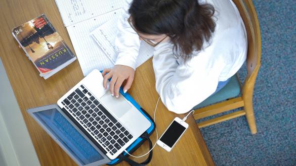 A student using a laptop