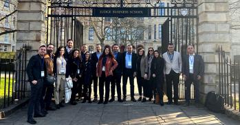 Students standing in front of Cambridge Judge Business School