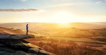 Person looking at sunrise