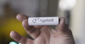 A hand holding a Nyobolt battery