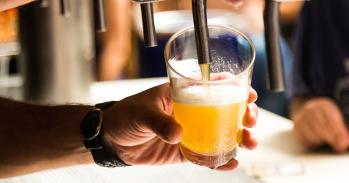Man pouring a pint of beer