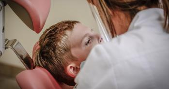 Child receiving dental treatment