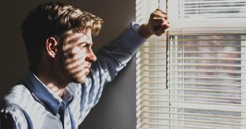 Man looking out of window