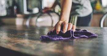 Wiping down the countertop 