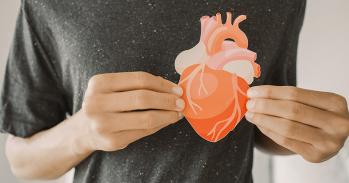Hands holding an image of a heart