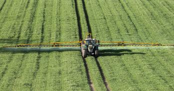 Wheat crops being sprayed with fertiliser