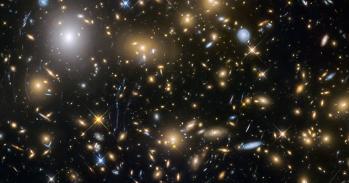 Observations by the NASA/ESA Hubble Space Telescope have taken advantage of gravitational lensing to reveal the largest sample of the faintest and earliest known galaxies in the universe. 