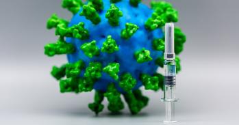 Model of coronavirus and hypodermic needle