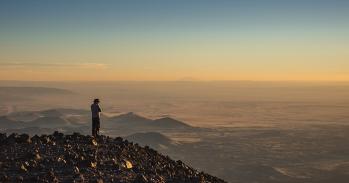 Man in a cowboy hat atop Humphreys Peak in Arizona, US