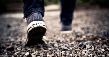 Feet walking on gravel