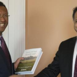 The President of the Republic of Madagascar, Hery Rajaonarimampianina, receiving a copy of Forests and Food during his recent visit to Cambridge