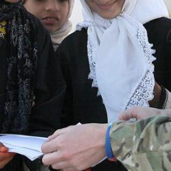 A British army sergeant visits a school in Helmand, Afghanistan.